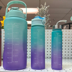 BLUE/PURBLE Set of 3 BPA-free Water Bottles 64 oz, 32 oz, and 16 oz. Motivational design with handle and straw. Matte finish in a beatiful gradient sky-blue color. Stay hydrated and inspired.